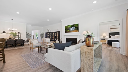 Living area with fireplace and windows.