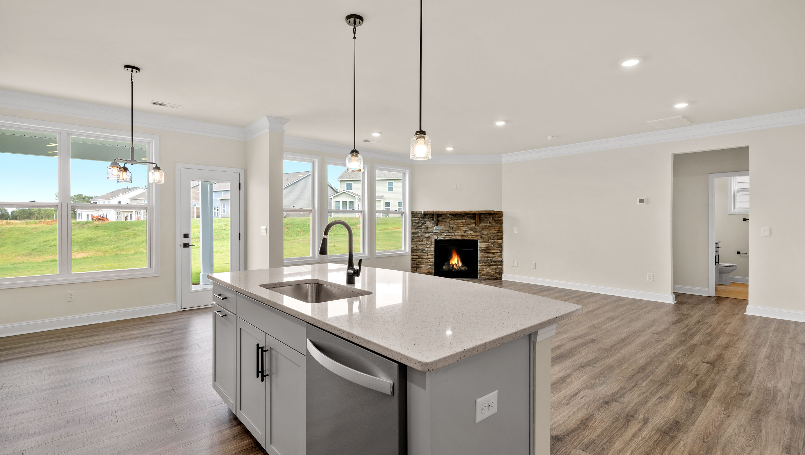 Kitchen and island with granite counter tops.