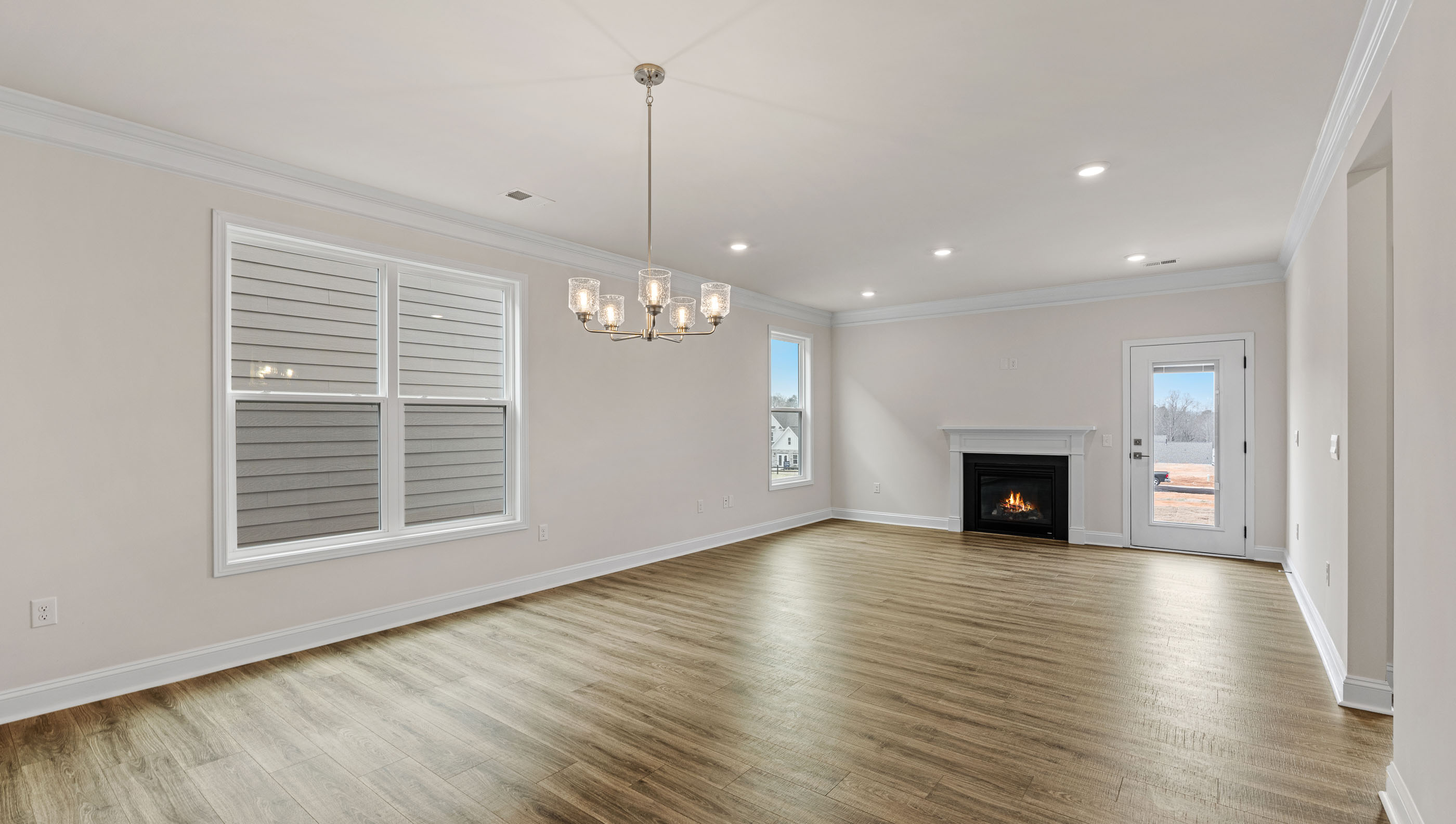 Living area with fireplace and windows.