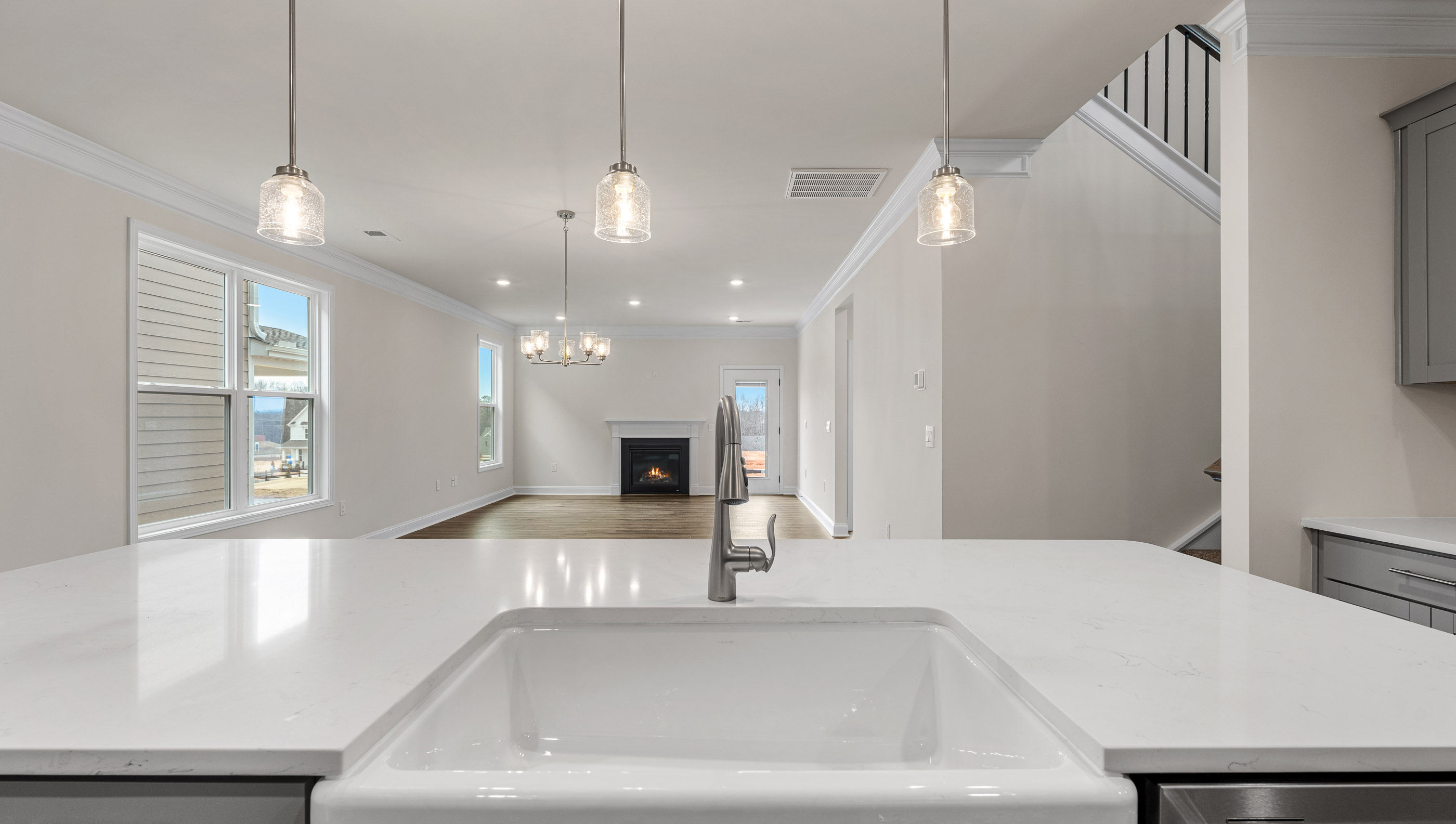 Kitchen with island and cabinets.