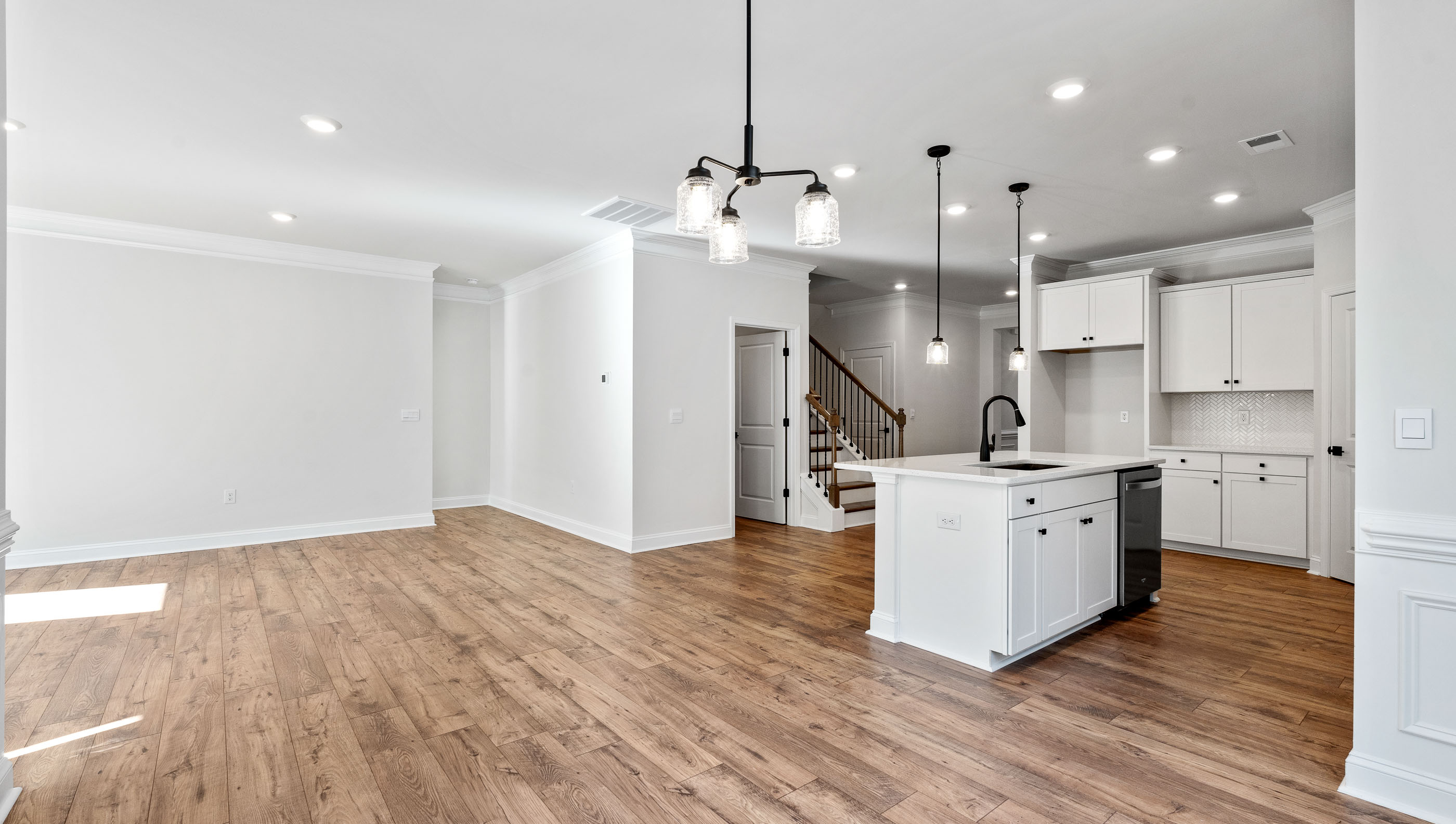 Kitchen and island with granite counter tops.