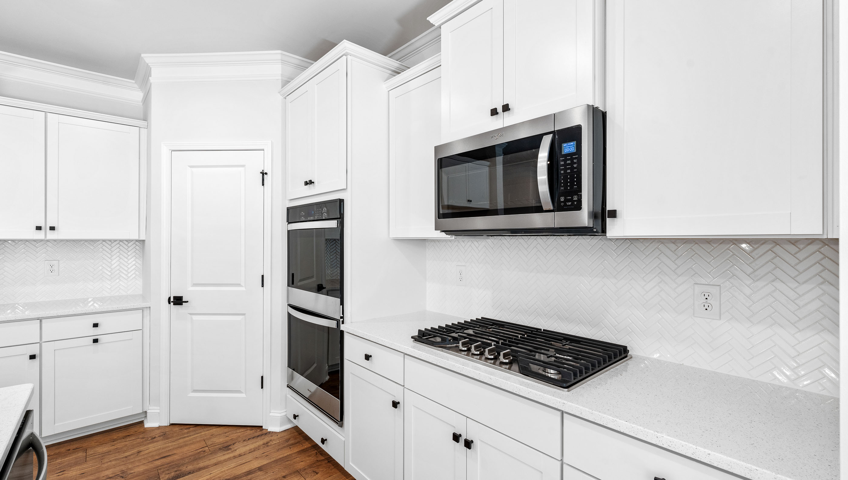 Kitchen and island with granite counter tops.
