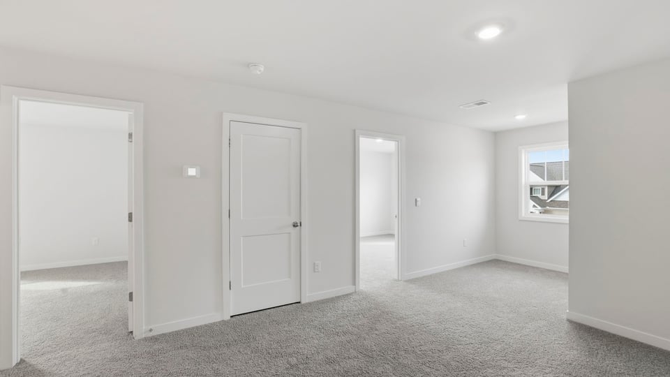 View of hallway and entrances to bedrooms.