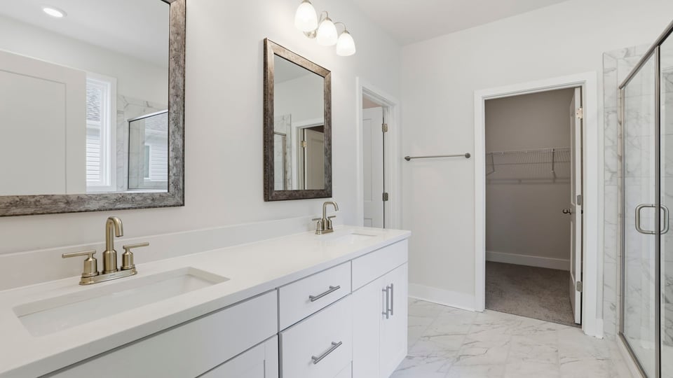 Primary bathroom with dual sink vanity.