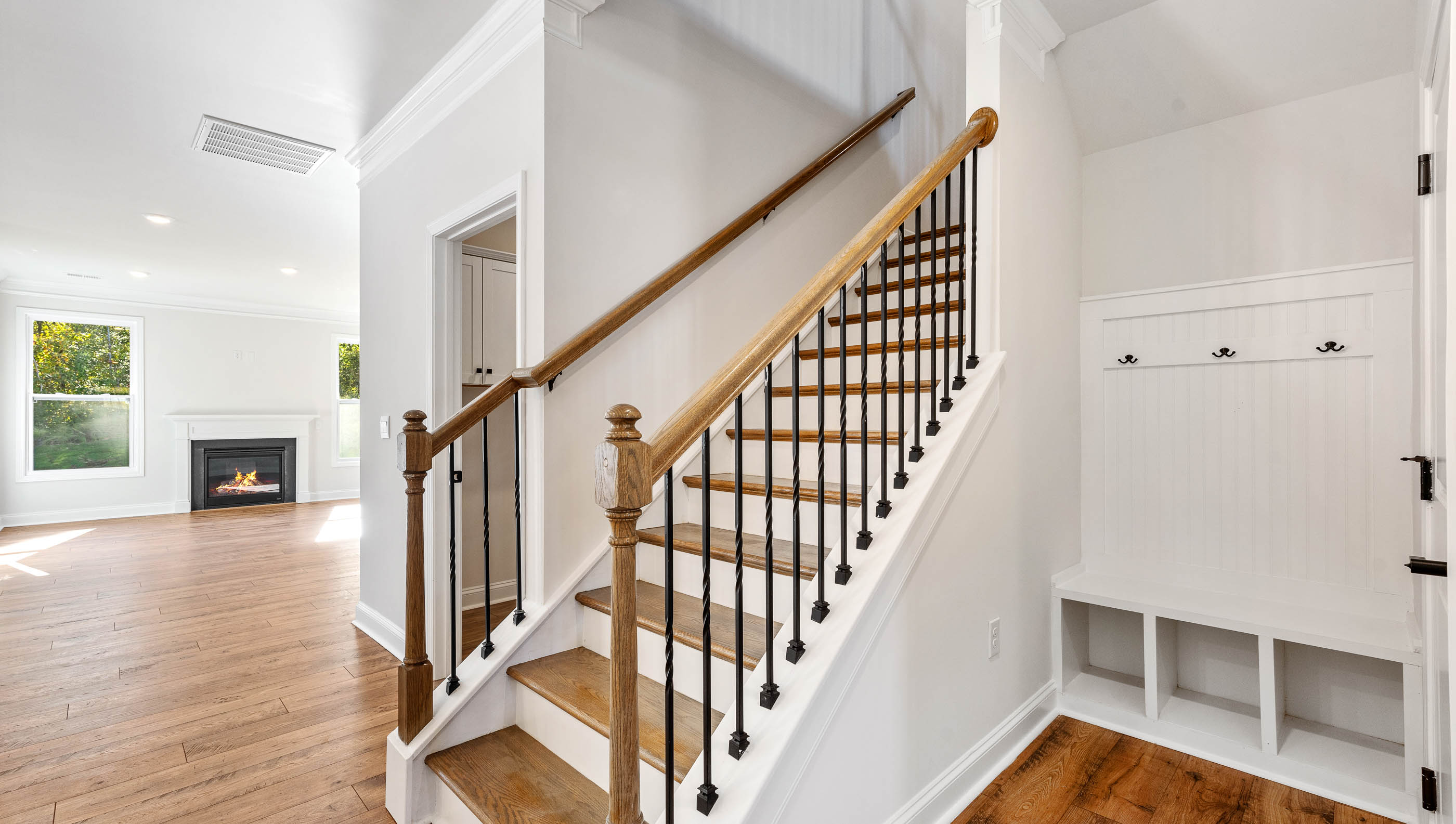Entry way into home with view of stairs.