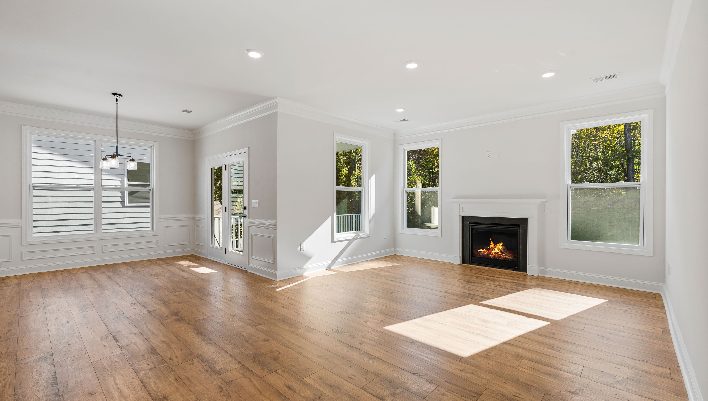 Family room with windows and fireplace.