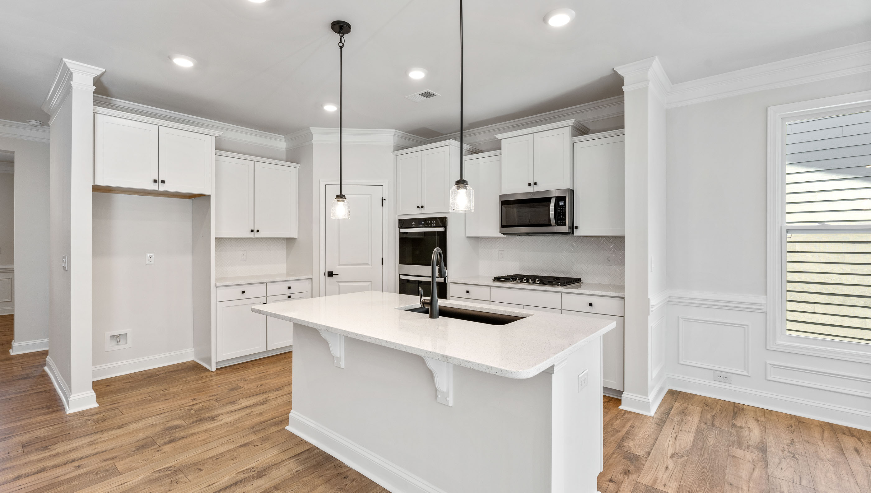 Kitchen and island with granite counter tops.