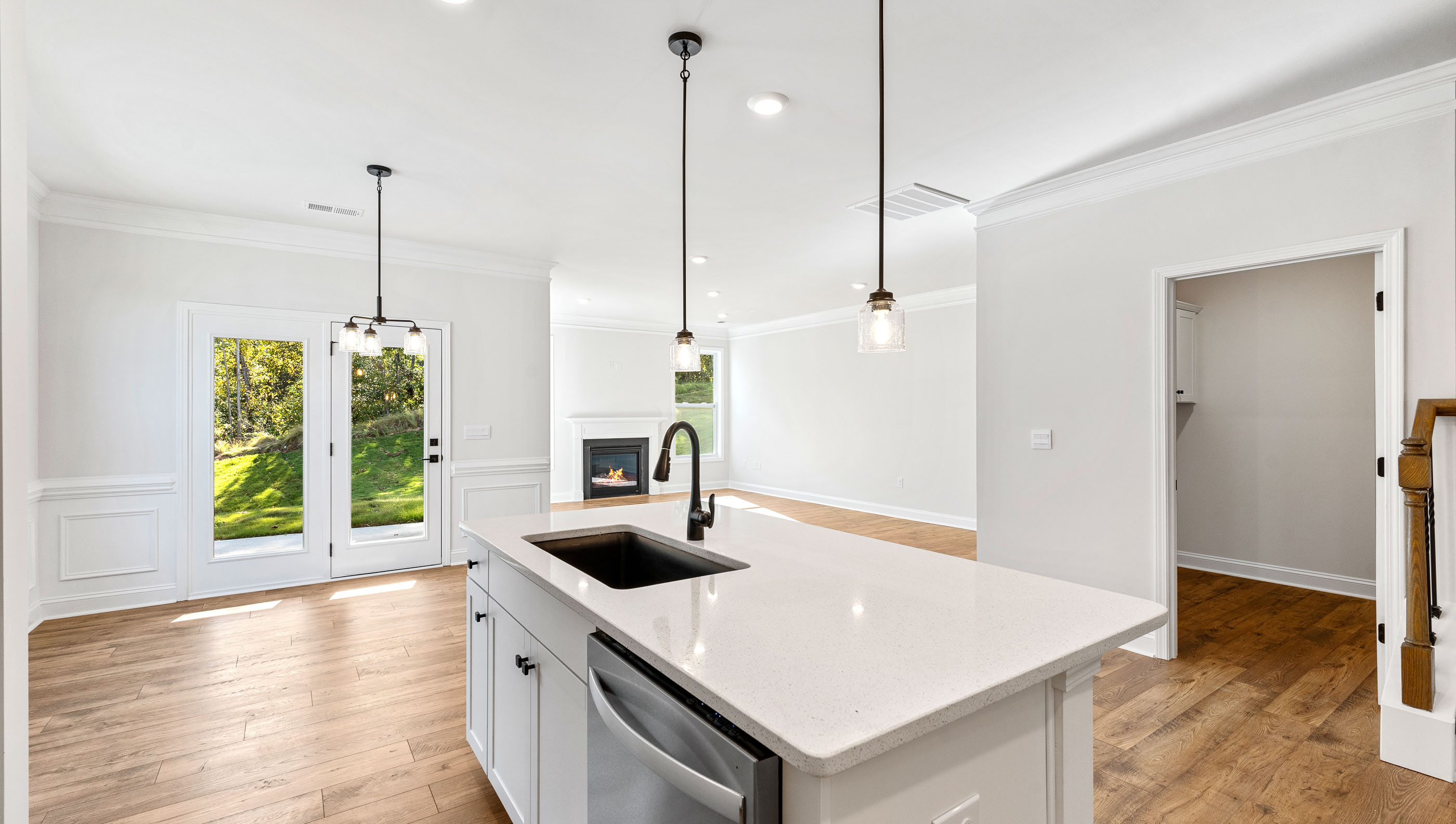 Kitchen and island with granite counter tops.