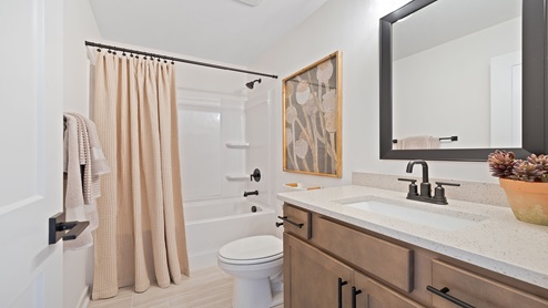 Bathroom with vanity sink and shower.