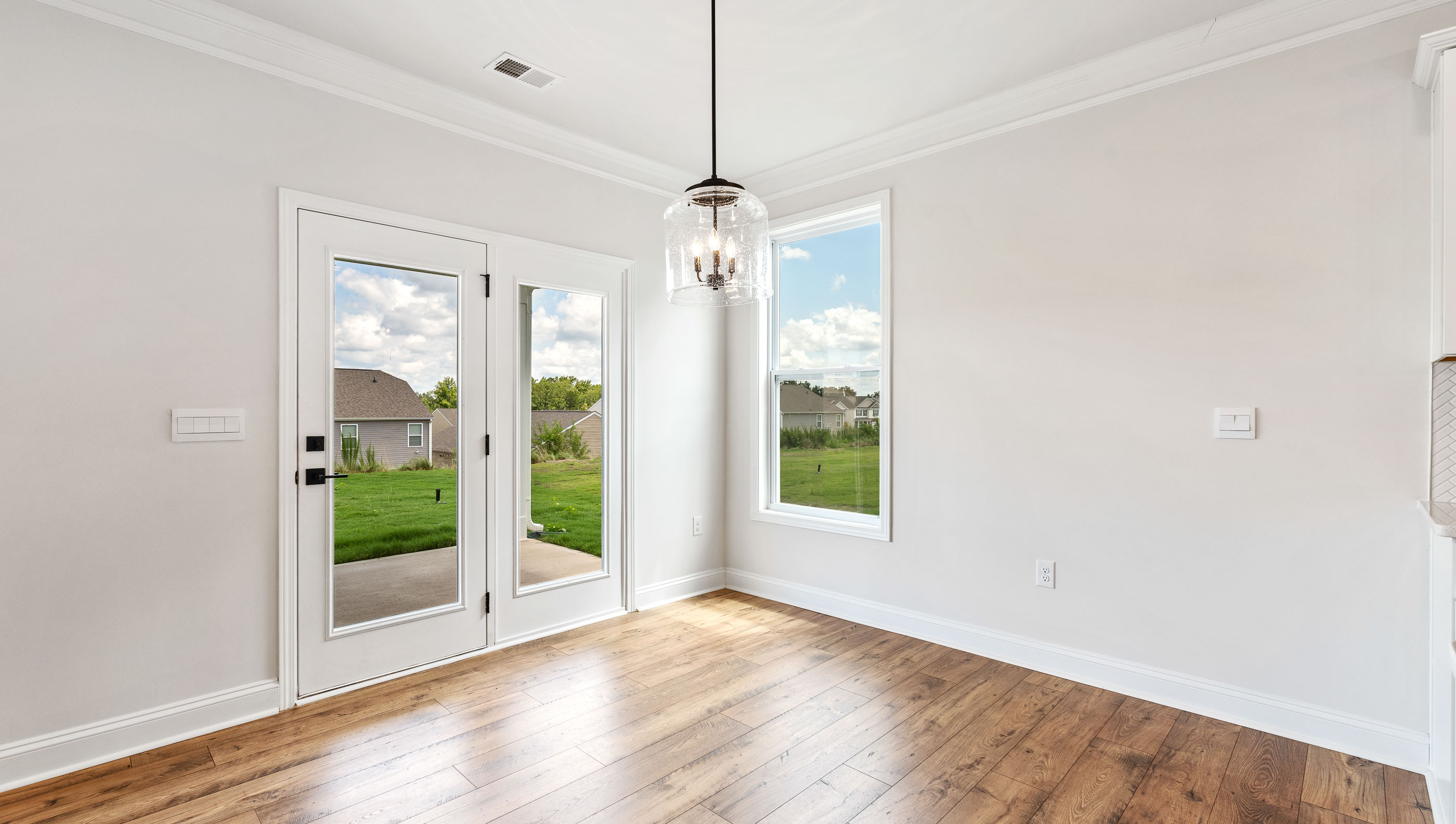 View of dining area and doors to outside patio.