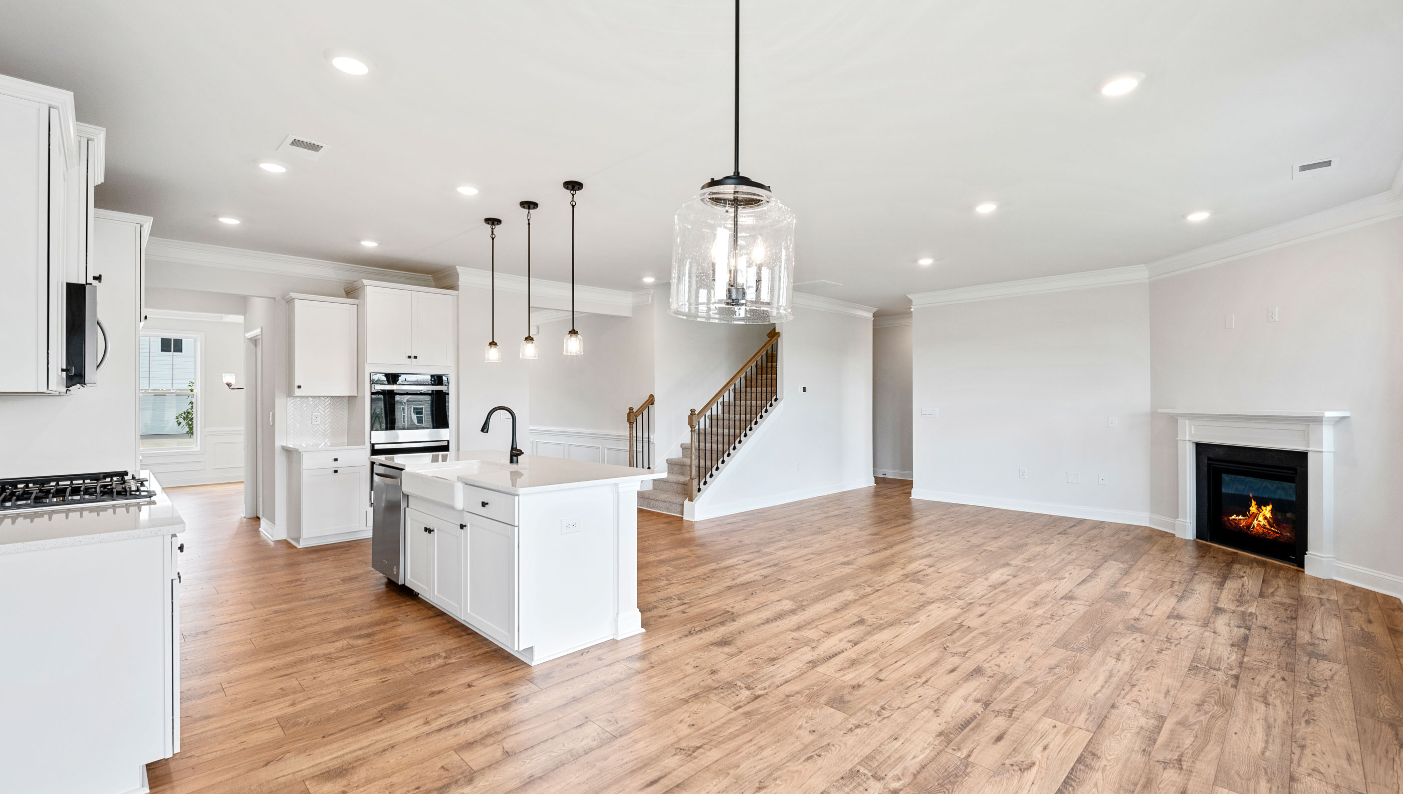 View of living area with gas log fireplace.
