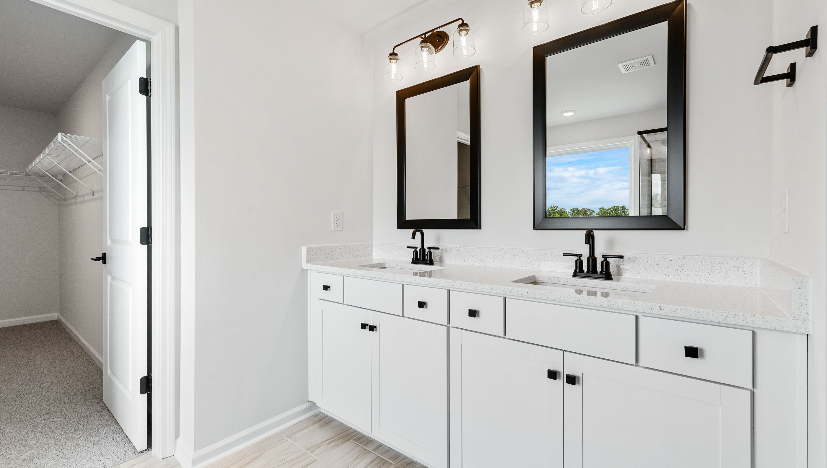 Primary bathroom with dual sink vanity.