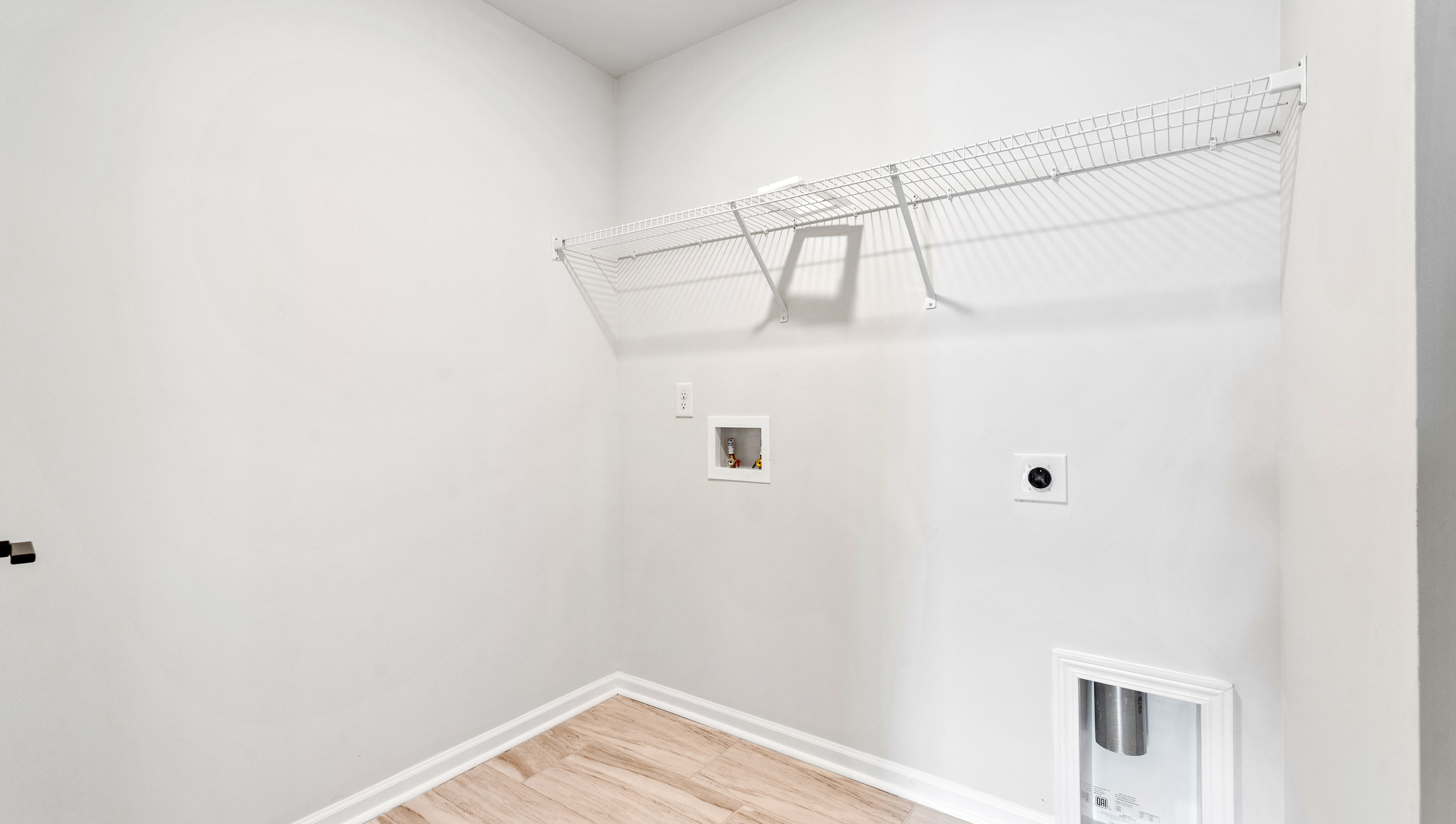 Laundry room with shelving.
