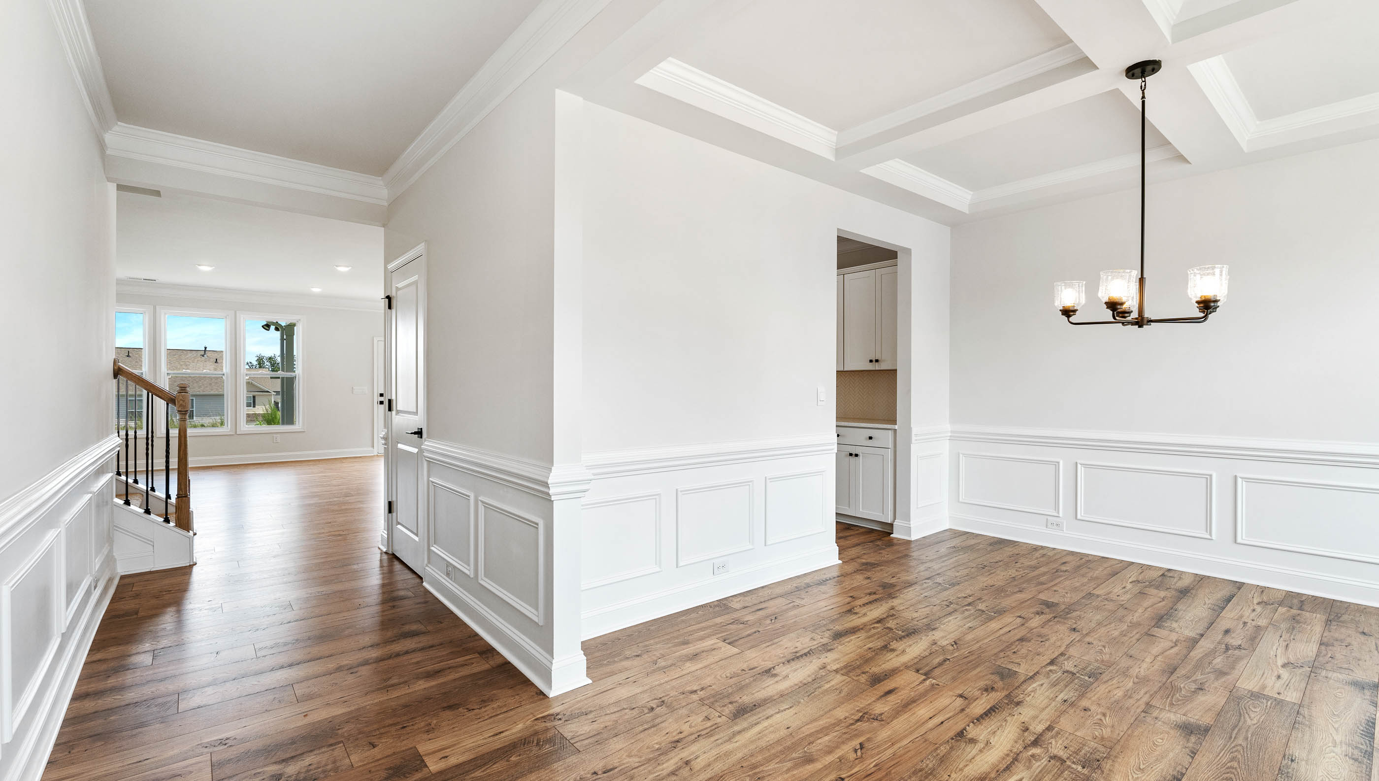 View of hallway to the living area and dining room.