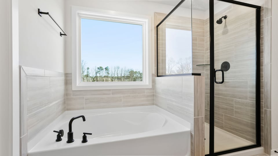 Primary bathroom garden tub and walk-in shower.