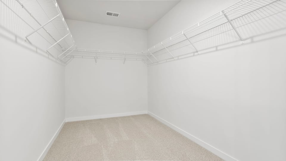 Primary bedroom walk-in closet.