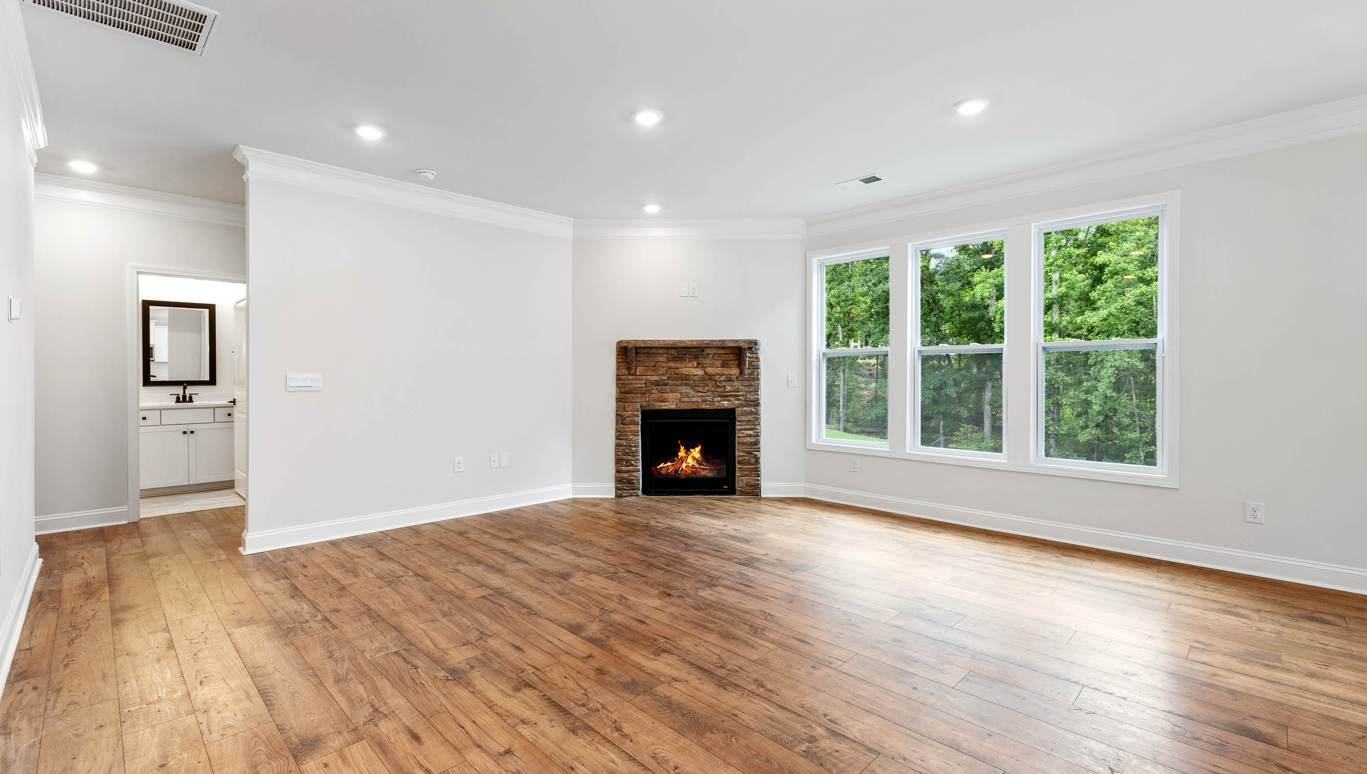Family room with fireplace and window.