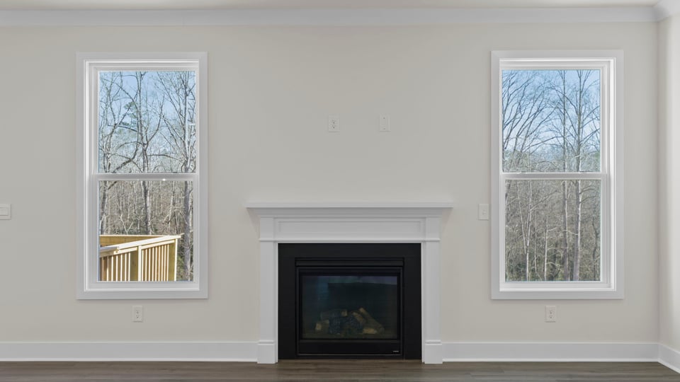 Living area with windows and fireplace.