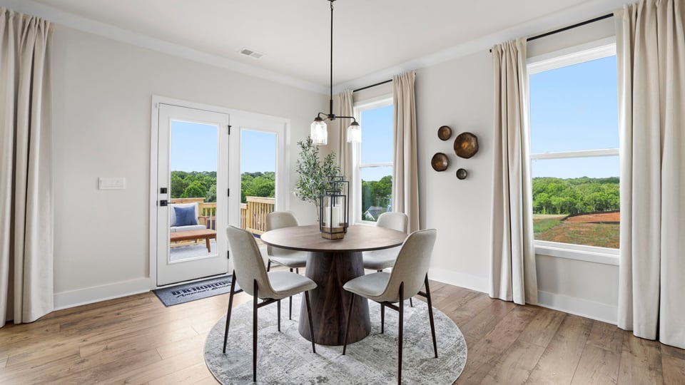 Kitchen and island with quartz countertops and stainless steel appliances.