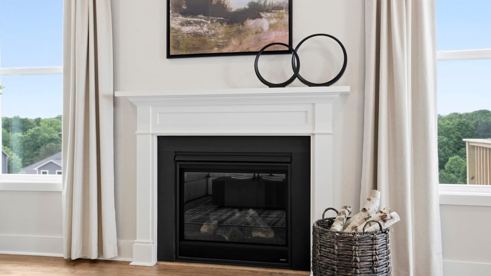 Family room with windows and fireplace.