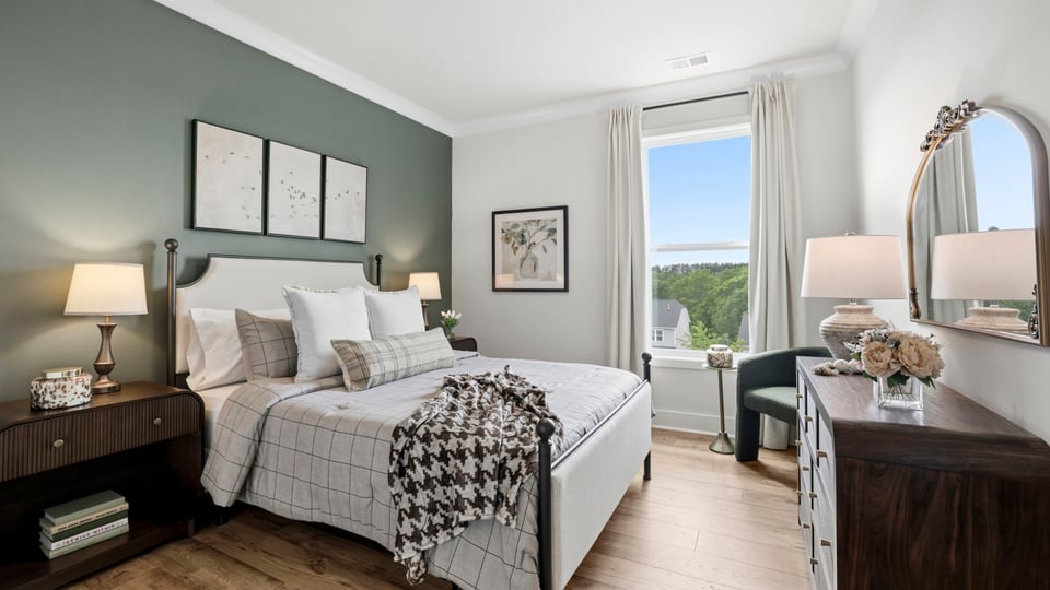 Bedroom with carpet and window.