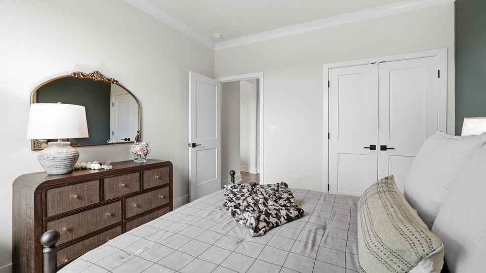 Bedroom with carpet and window.
