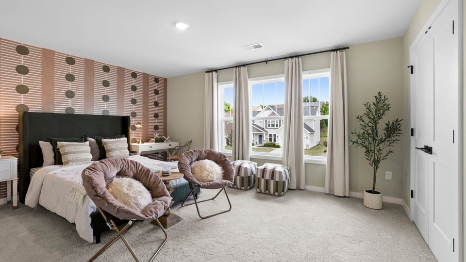 Bedroom with carpet and window.