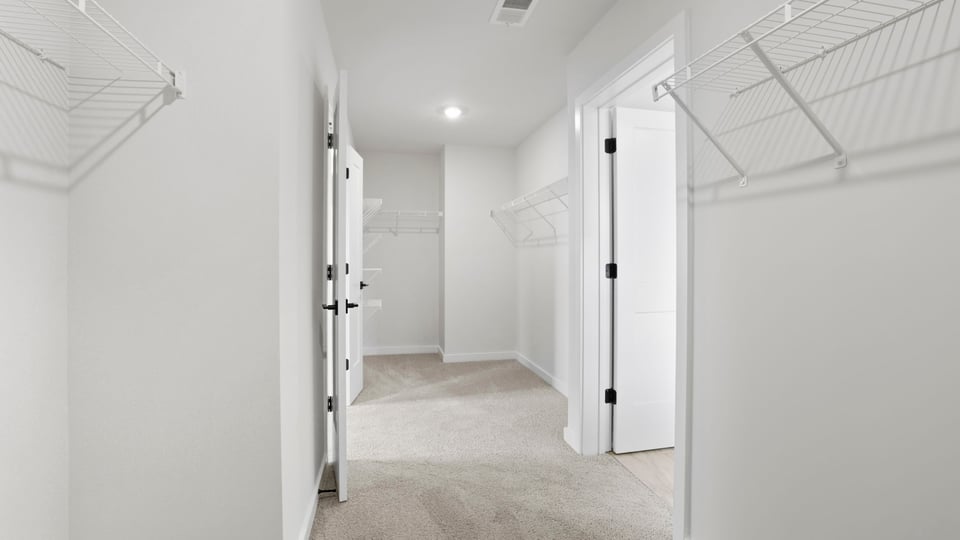 Closet with hanging storage racks.