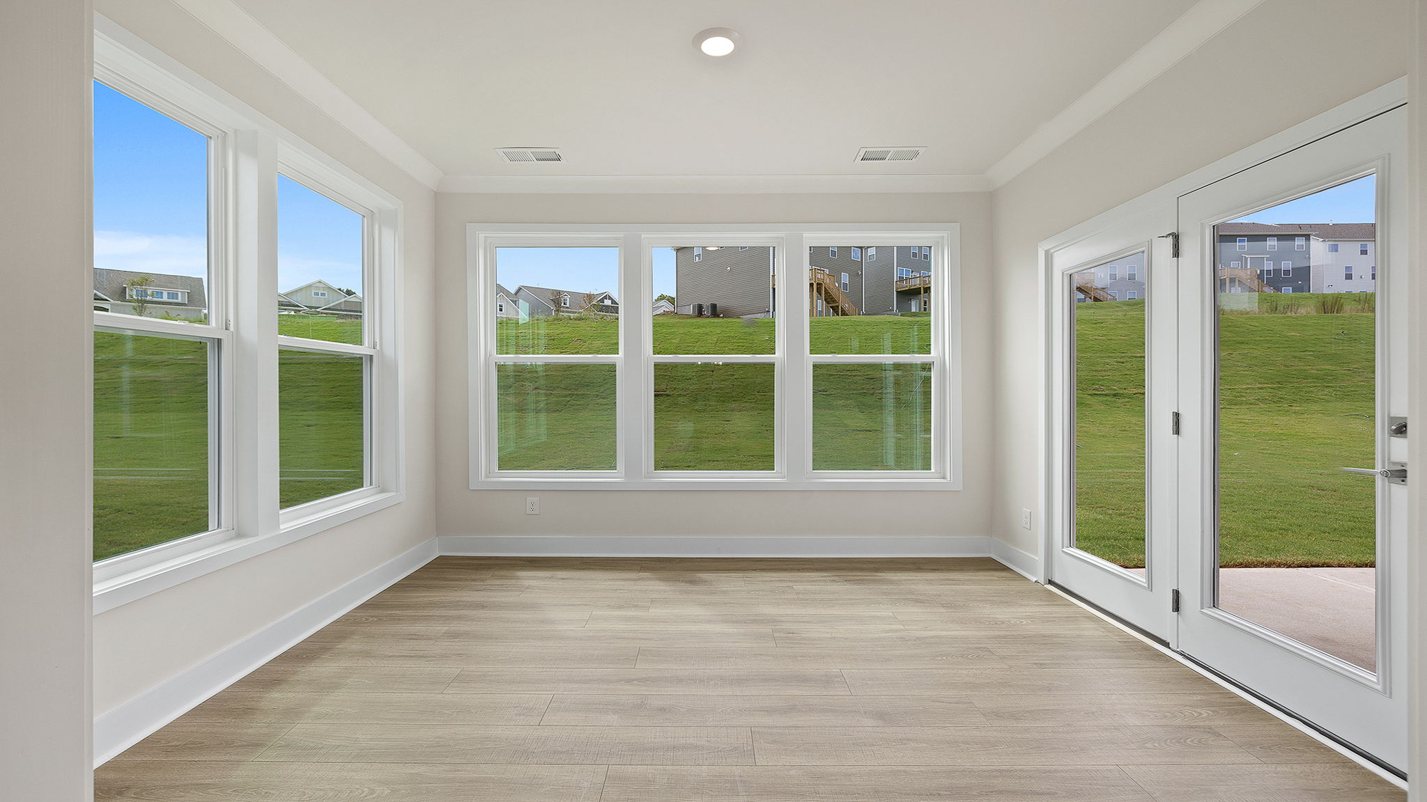 View of great room and stairwell to the second level of the home.