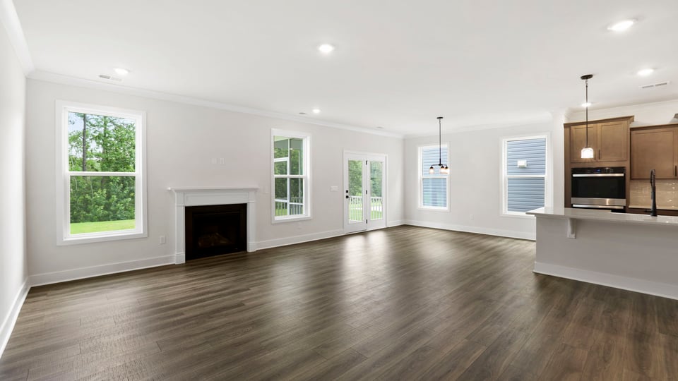 Family room with windows and fireplace.