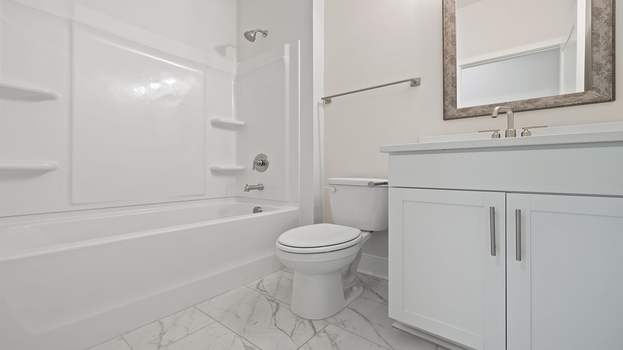 Main floor bathroom with combination tub / shower.