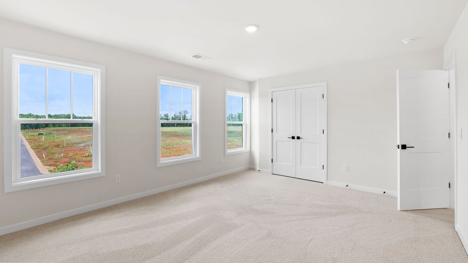 Loft area with carpet.