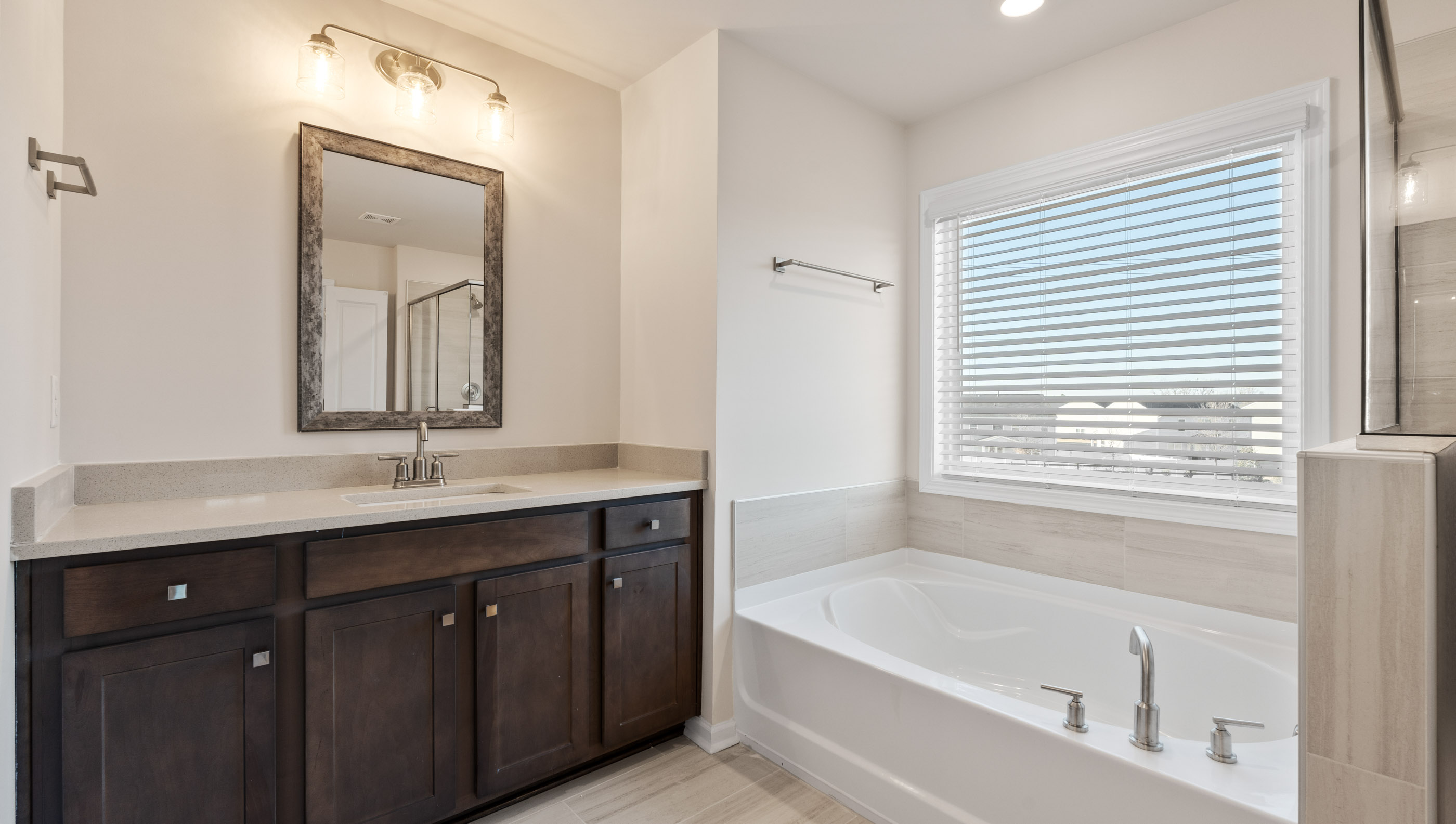 Her vanity and garden tub.