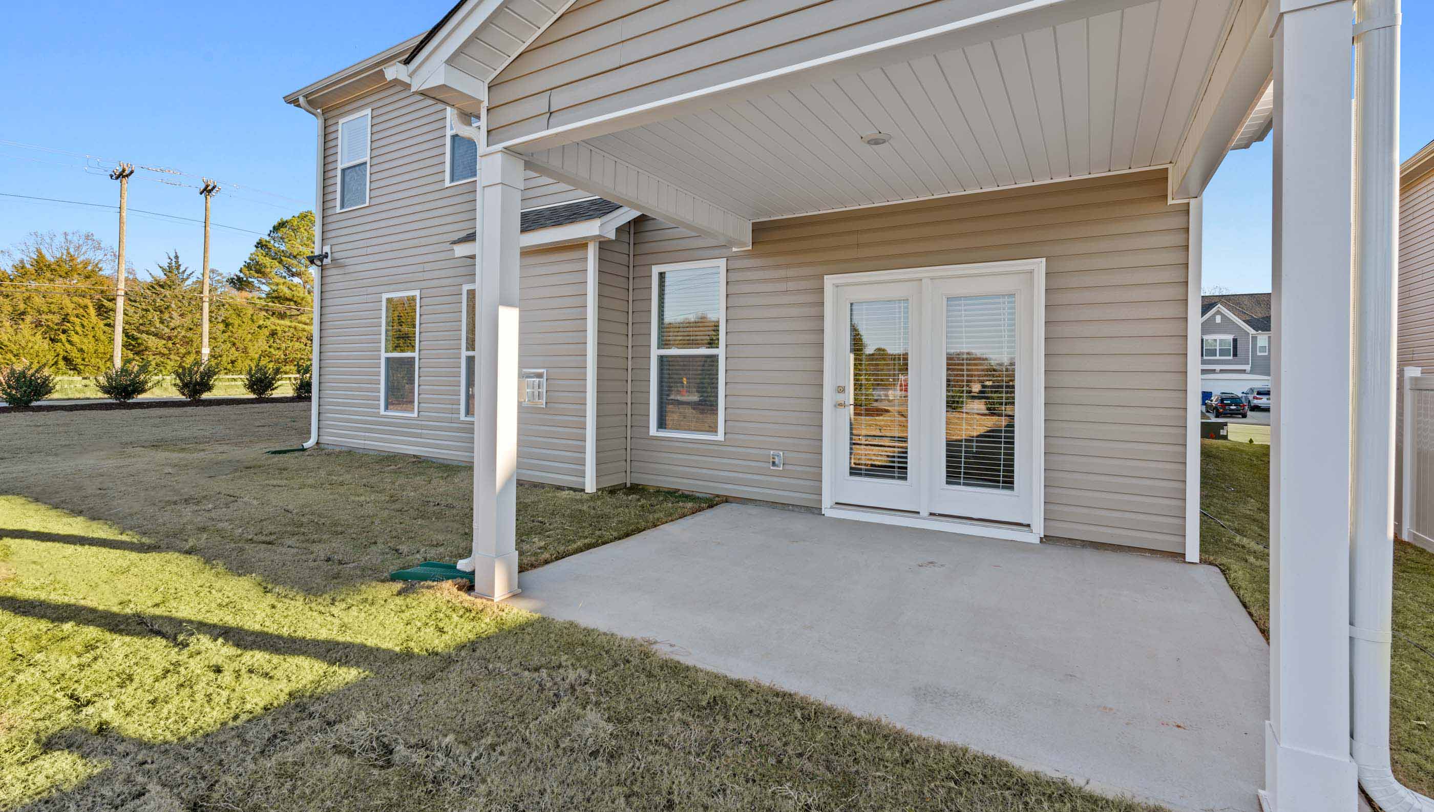 Covered porch at rear of home.