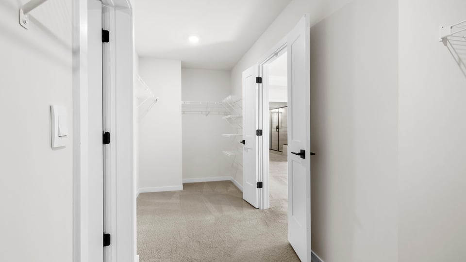 Primary bedroom walk-in closet.