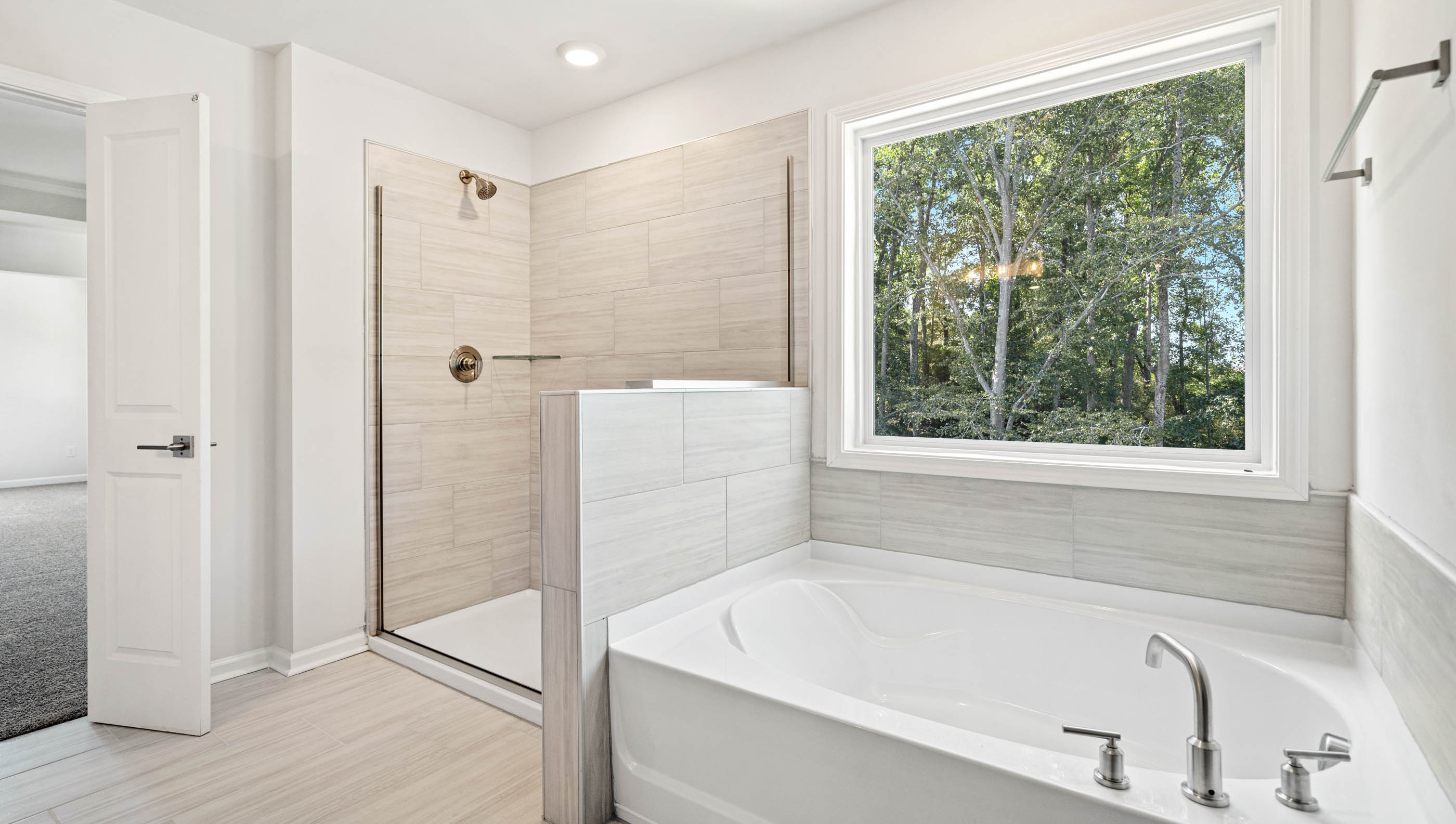 Bathroom with tub and walk in closet.