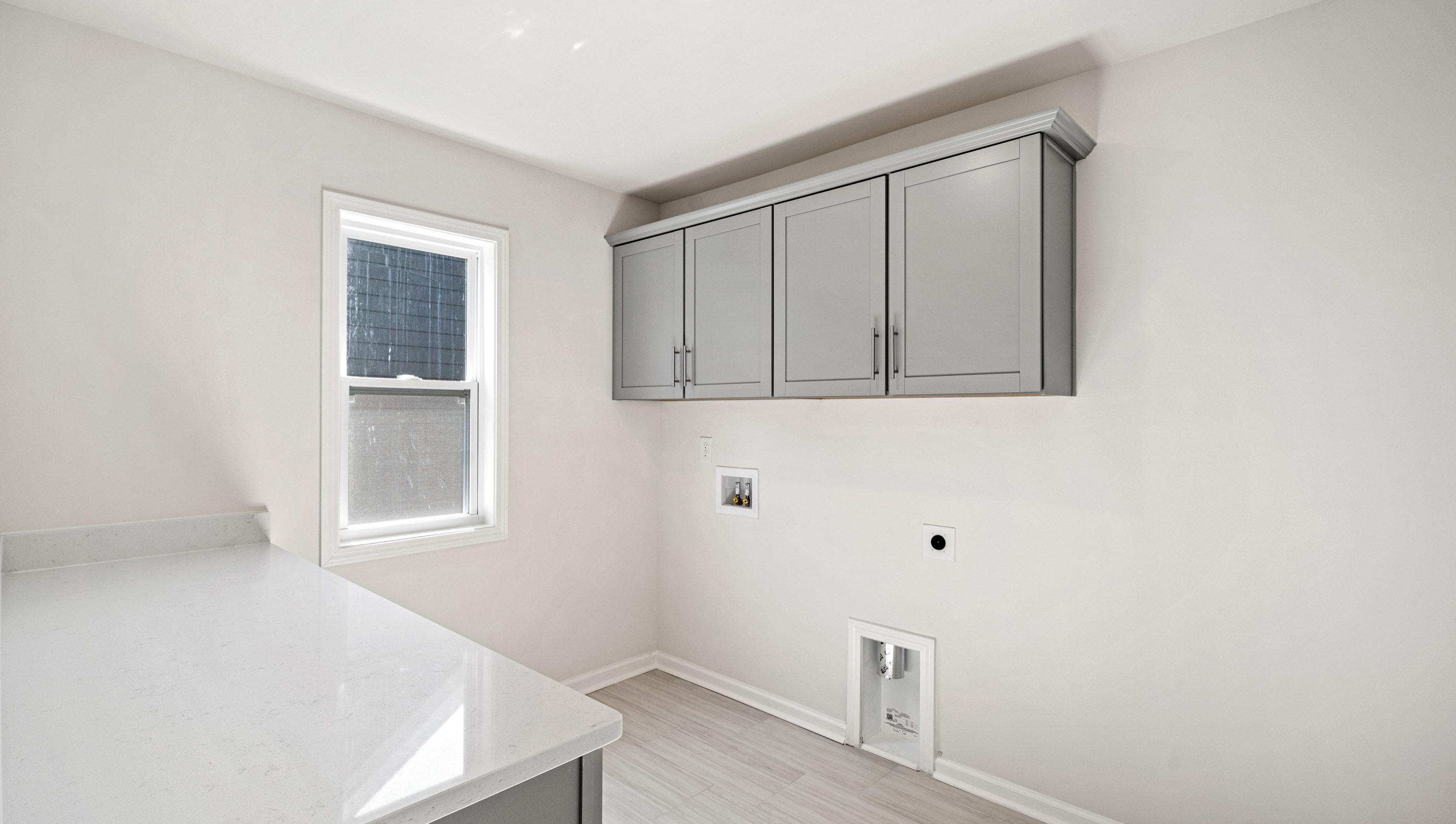 ;laundry room with window.