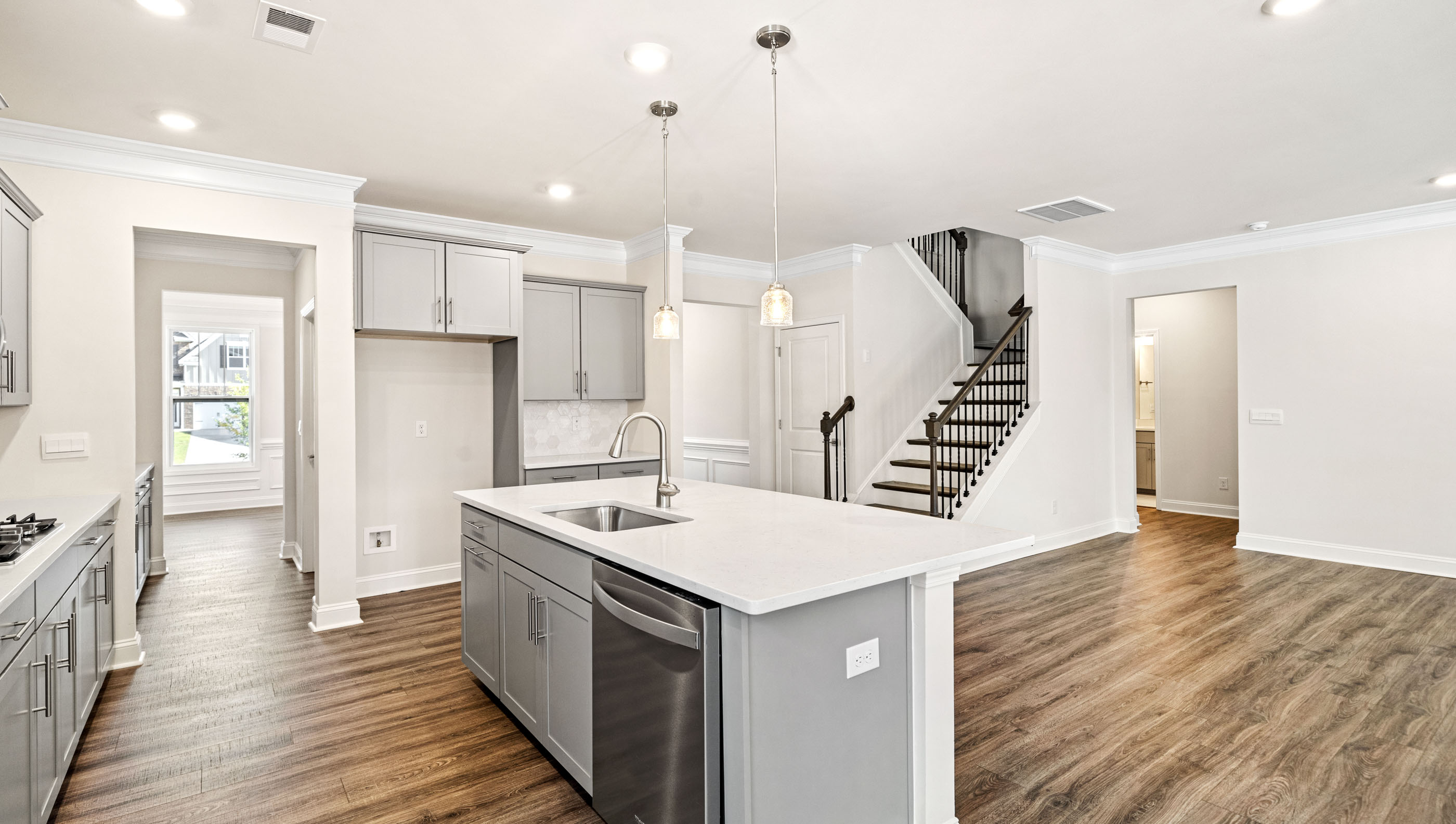 Kitchen and island with granite counter tops.