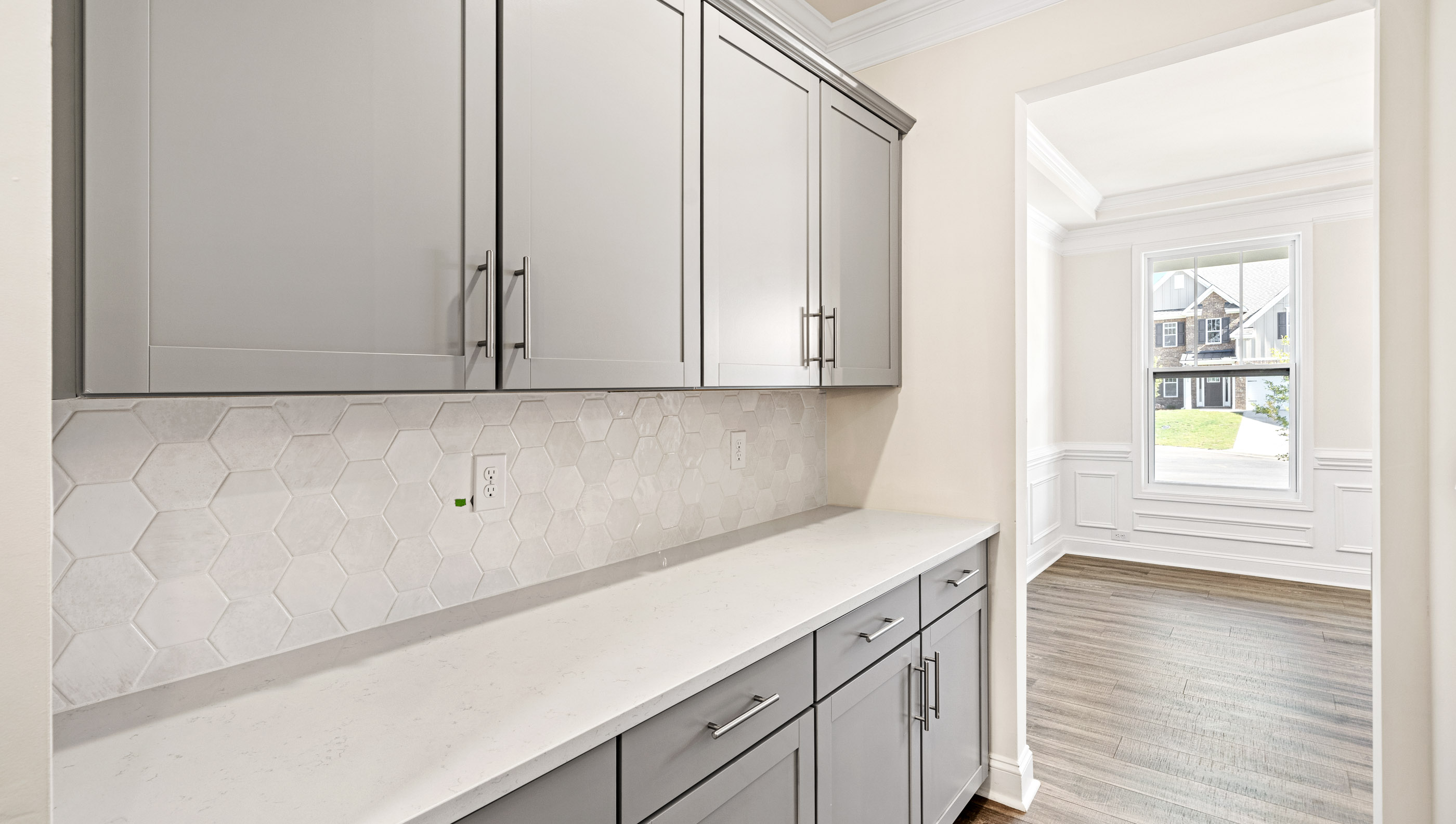 Butlers pantry with cabinets.