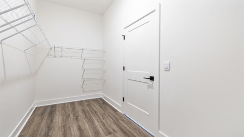 Primary closet with shelves.