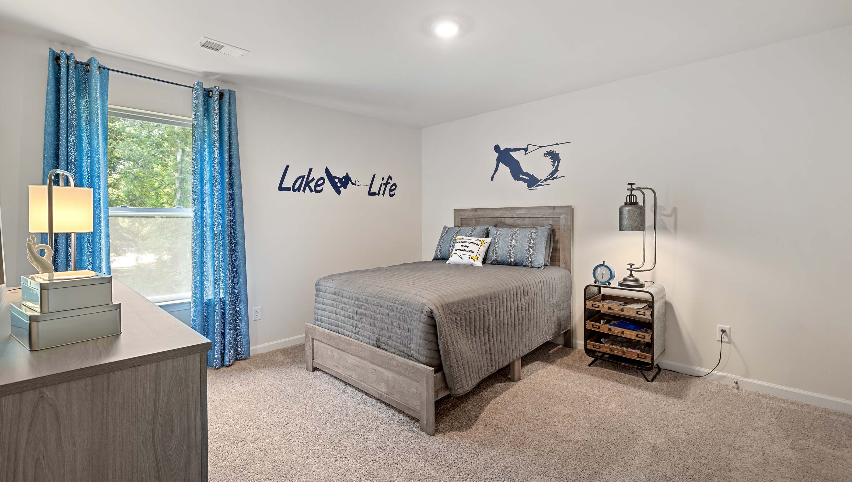 Bedroom with carpet and windows.