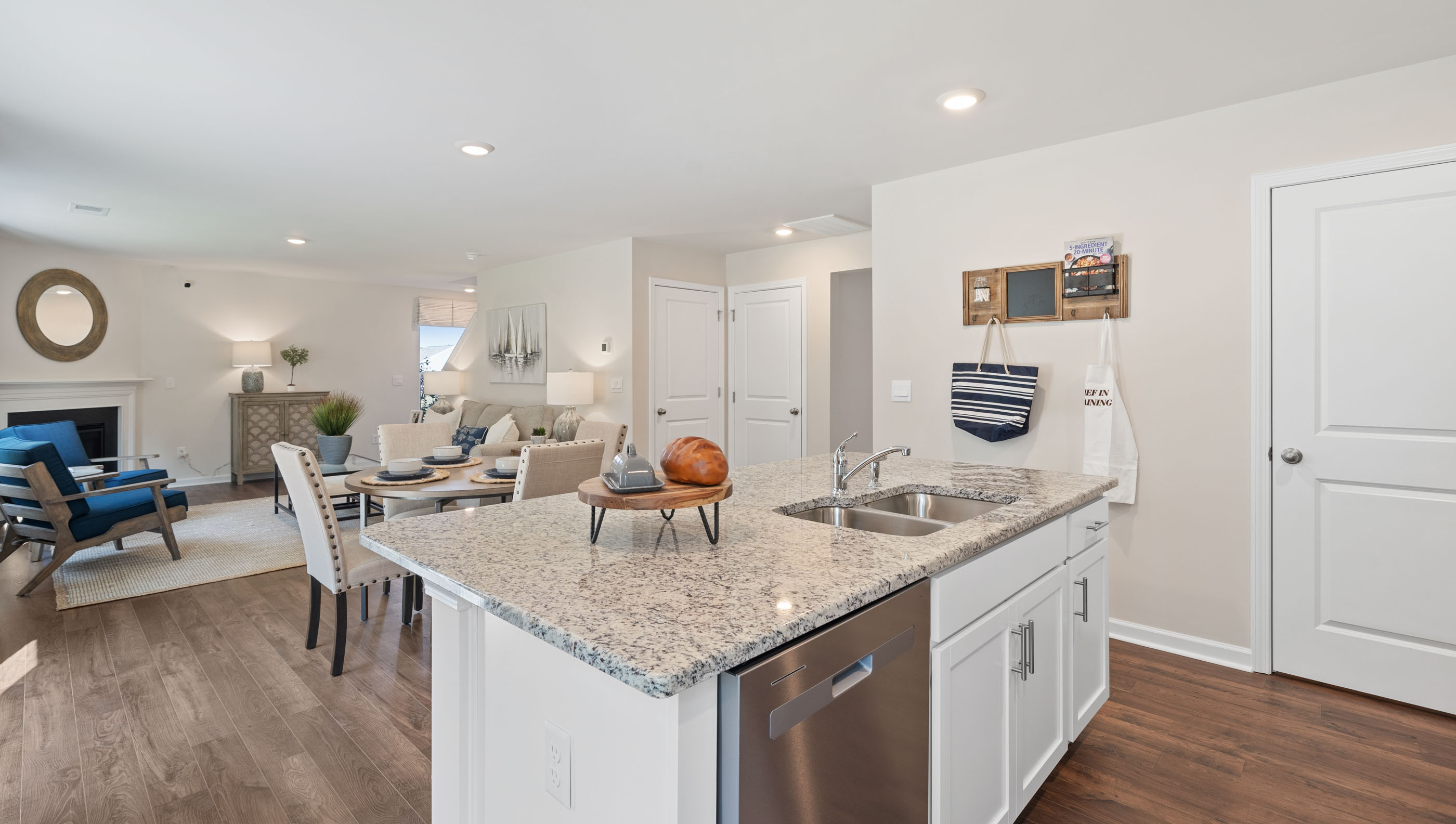 Kitchen and island with view of family room.