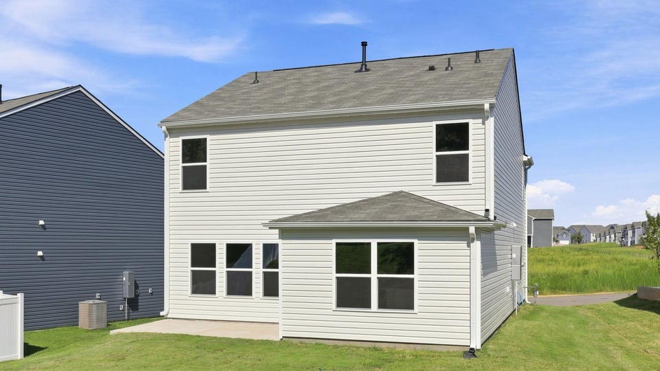 Back exterior with large backyard.