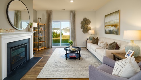 Family room with fireplace and large window