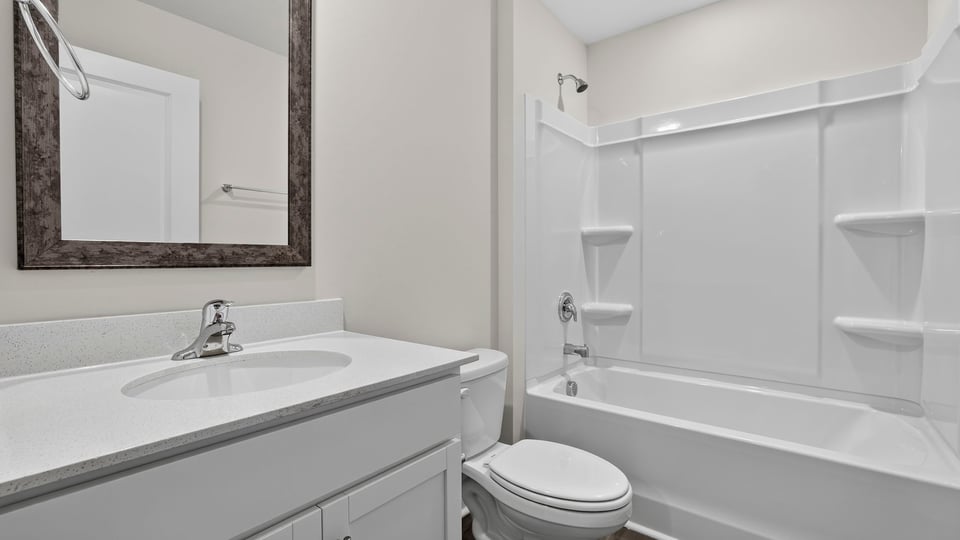 Bathroom with vanity and tub.