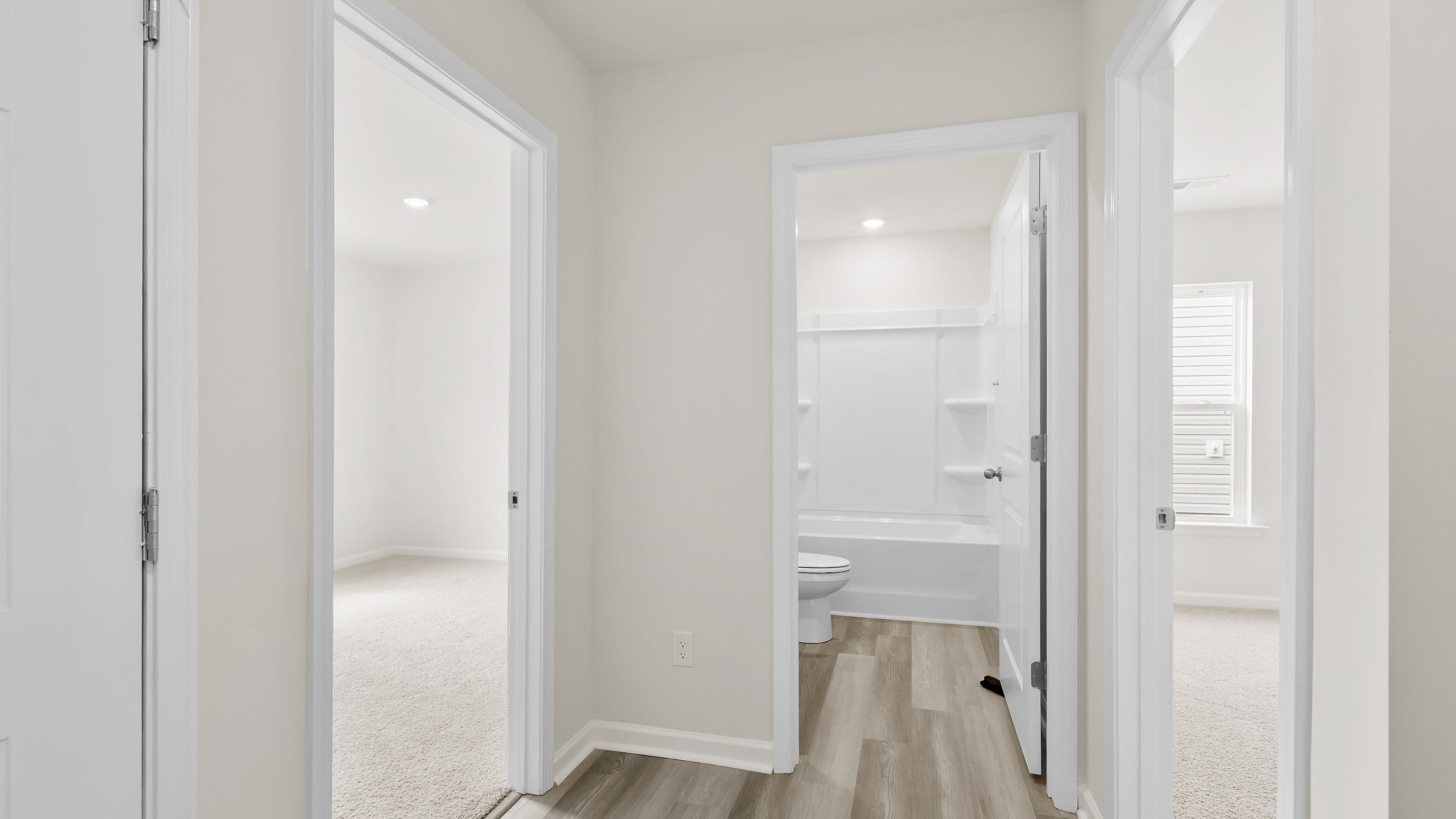 Bedroom with carpet and window.