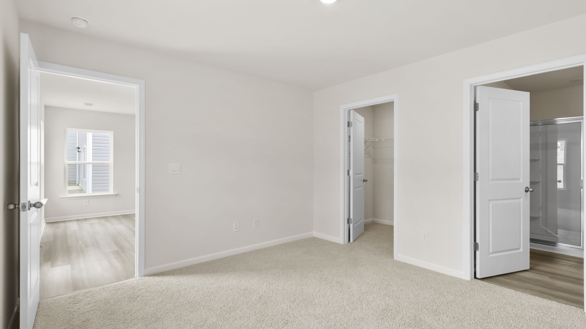 Bedroom with carpet and window.
