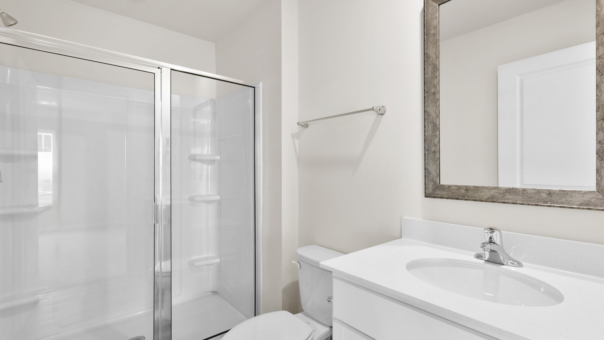 Bathroom with sink and walk in shower.