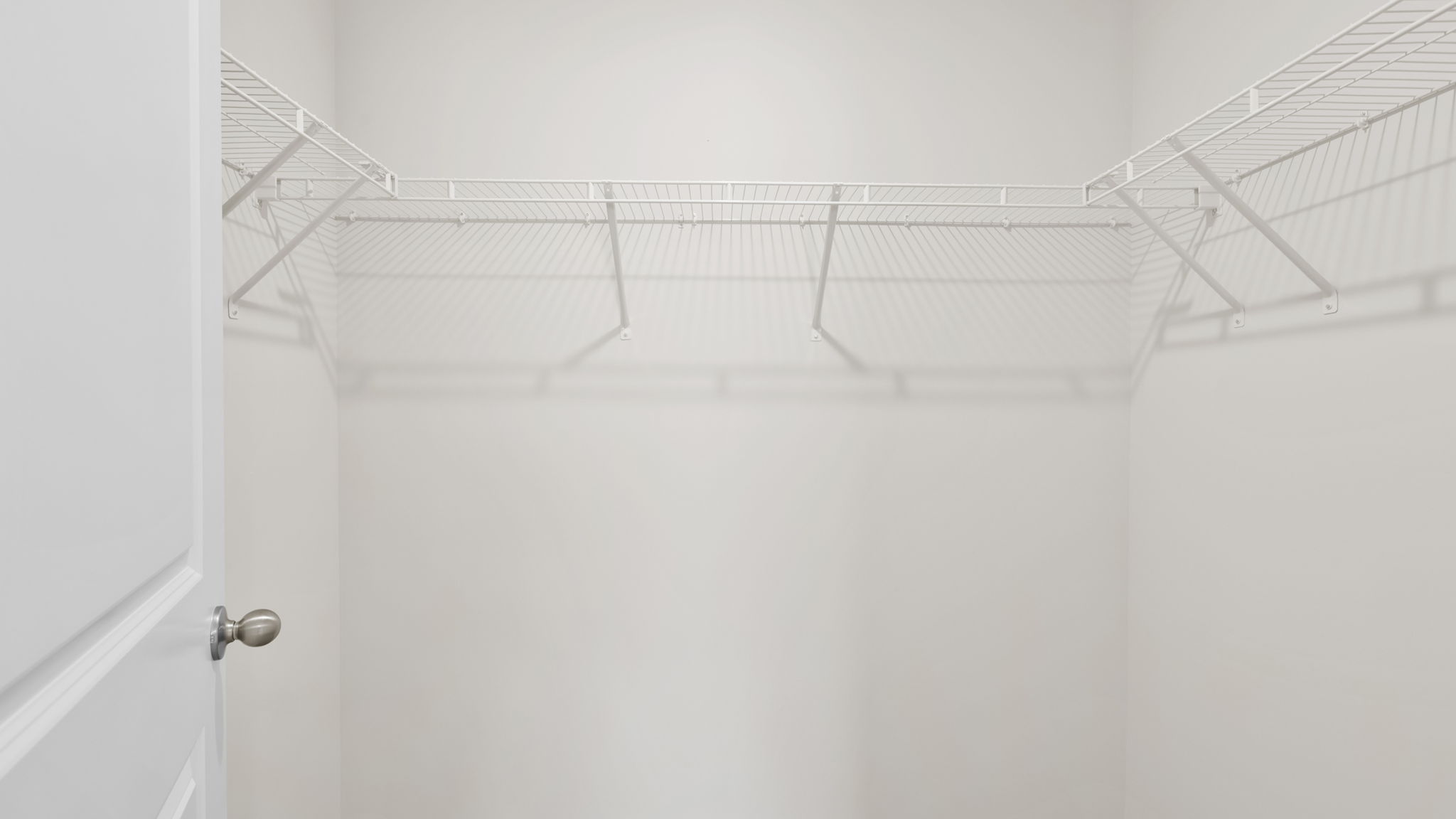 Closet with hanging storage racks.
