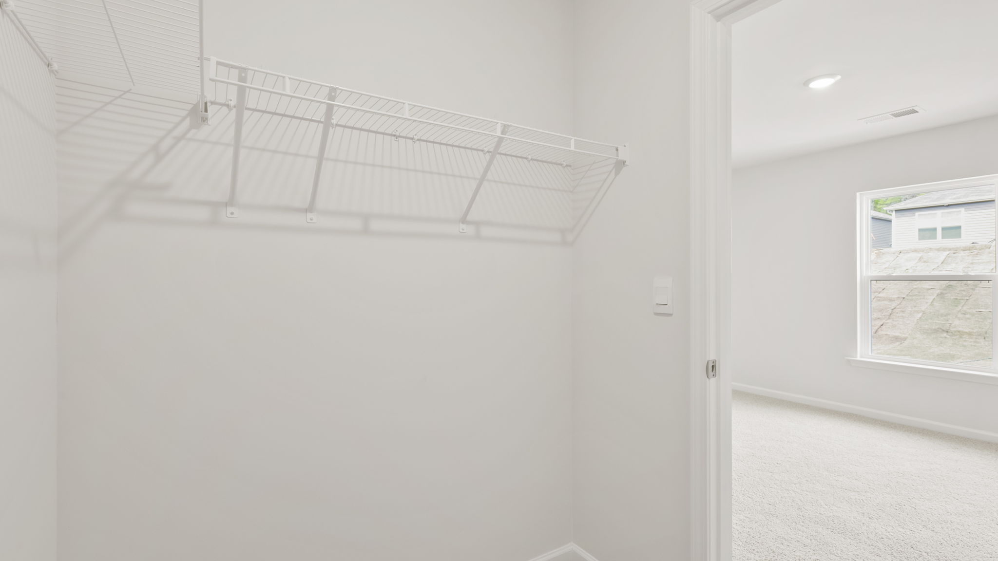 Closet with hanging storage racks.